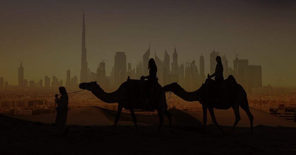 Tourists on camels watching a futuristic city